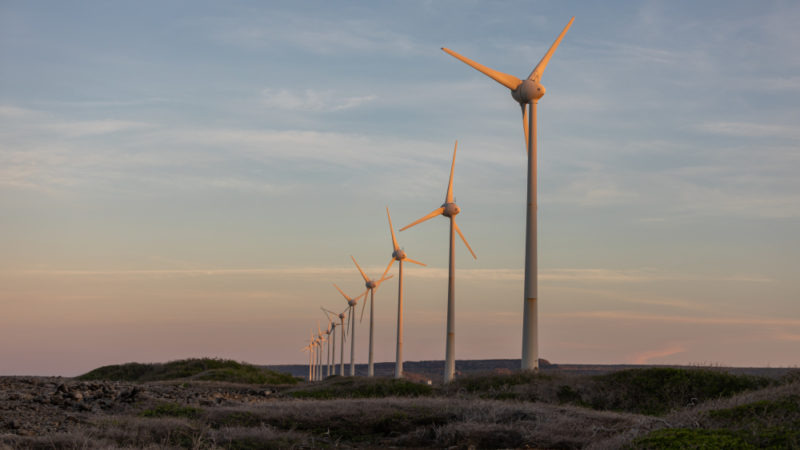low-angle-shot-windmills-middle-field-during-sunset-bonaire-caribbean